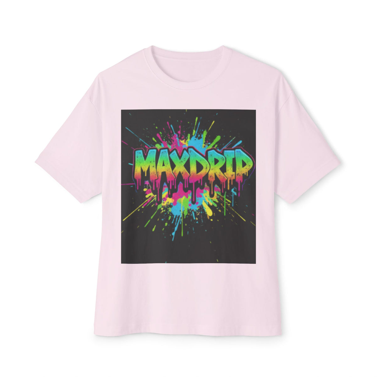 A light pink short-sleeve t-shirt with a large square graphic on the chest. The graphic features the word 'MAXDRIP' in a vibrant, dripping neon paint style with splatters of pink, blue, yellow, and green on a black background.